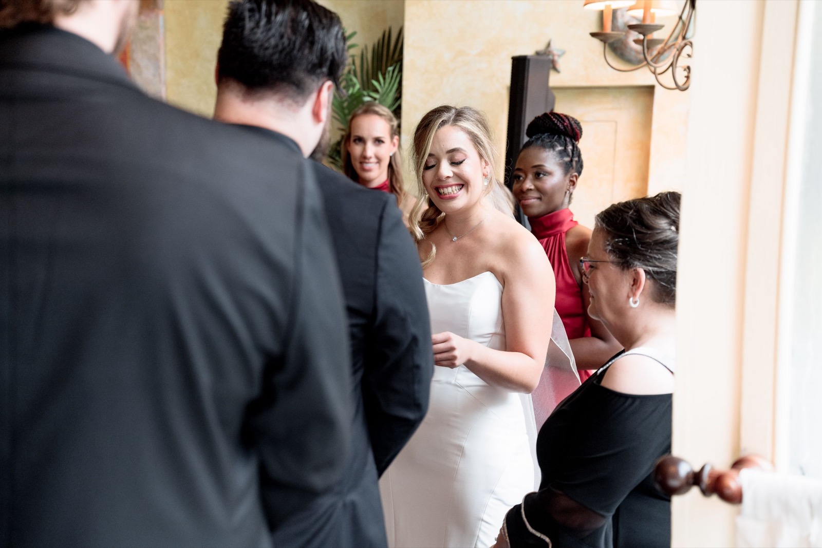 The couple facing each other during their wedding ceremony