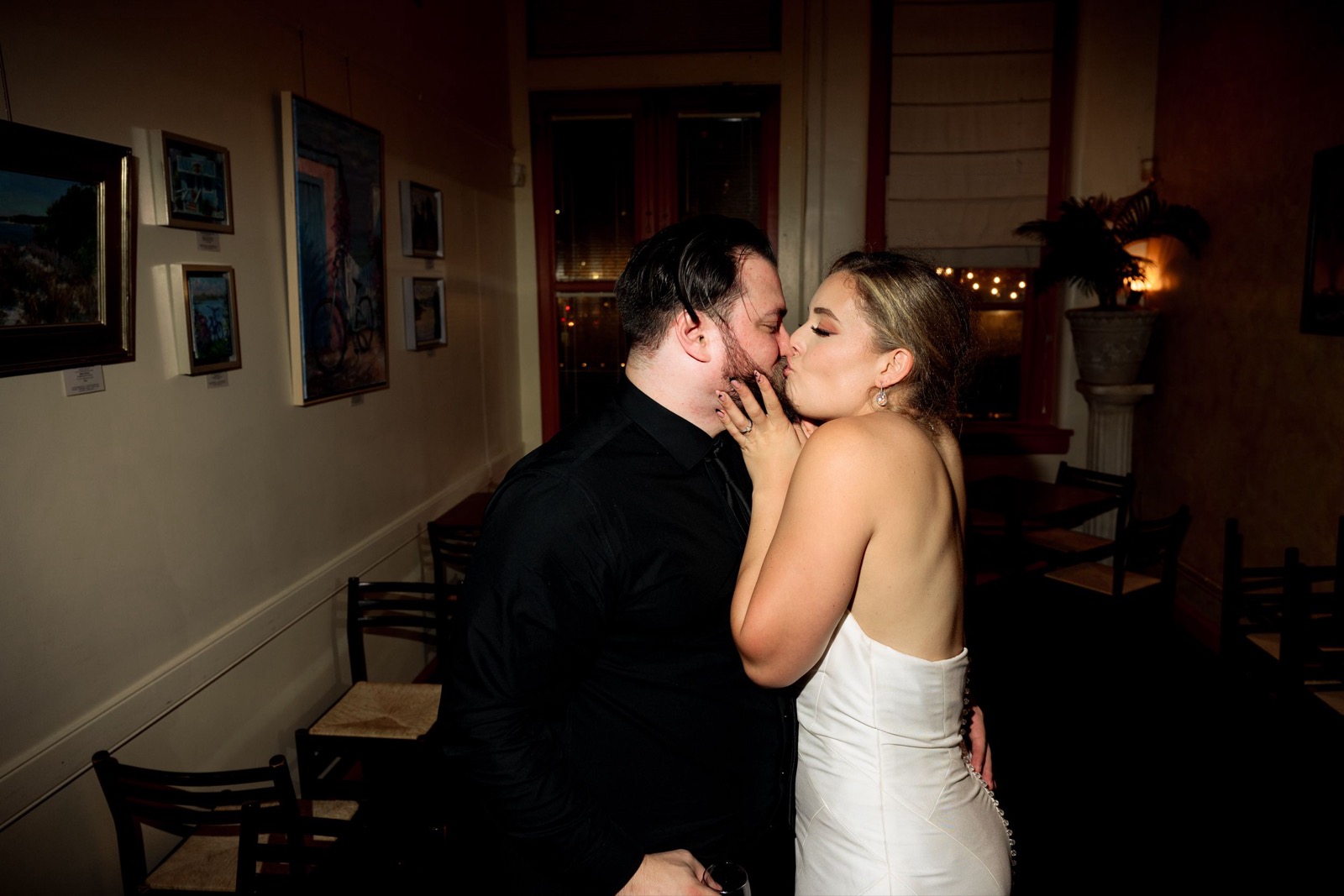 The couple embracing during their reception